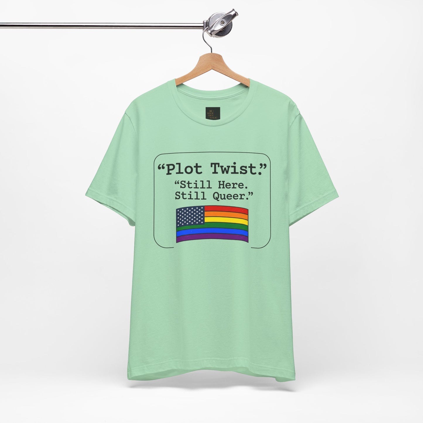 Plot Twist Tee — "Still Here. Still Queer." | Pride Celebration Line