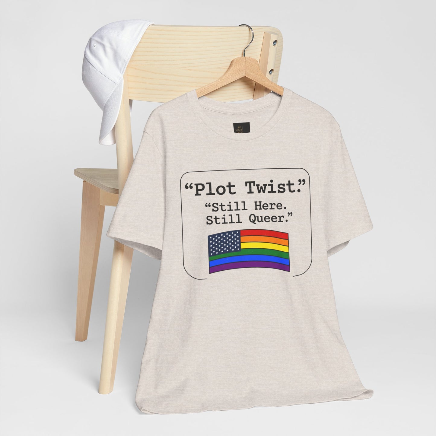 Plot Twist Tee — "Still Here. Still Queer." | Pride Celebration Line